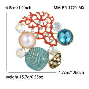 Ocean themed brooch with red coral, pearl, blue gemstone and sea shell on gold metal base
