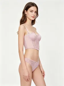 Detail of pink floral lace bustier set with steel bone support and sheer mesh texture