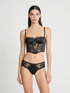 Detail of black lace and satin bustier with boning structure and eyelash lace trim