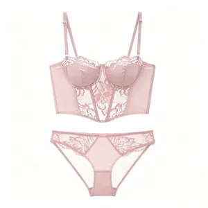 Elegant pale pink lace bustier lingerie set with floral embroidery and satin detail