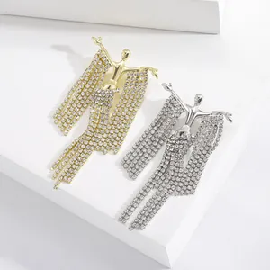 Elegant gold and silver tassel brooches with human sculpture design and sparkling crystals