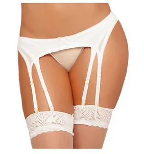 Detail of white lace garter belt set with ribbon bow and adjustable suspender straps