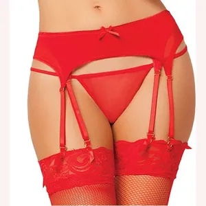 Red lace lingerie set with high waisted garter belt, thong, and fishnet stockings