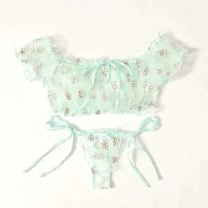 Mint green lace lingerie set with delicate floral embroidery and bow details