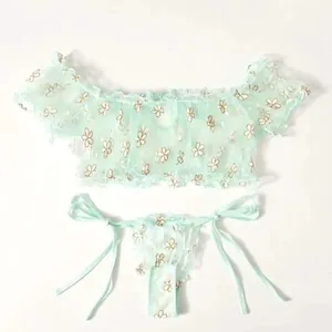 Lace two-piece lingerie set in mint green mesh with floral embroidery and ruffled trim