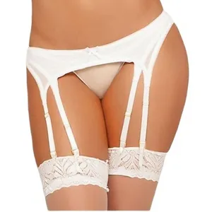 White lace garter belt set with bow detailing and adjustable straps on female model