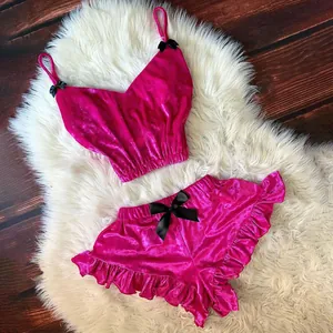 Set lingerie due pezzi in velluto rosa con fiocchi neri e bordi a volant da donna