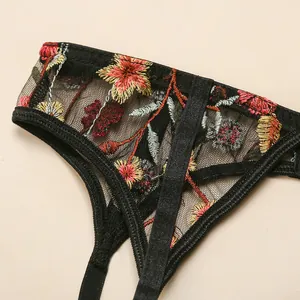 Sexy black lace lingerie set featuring detailed floral embroidery on sheer mesh fabric