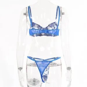 Detailed back view of a blue lace lingerie set with floral embroidery and buckle design