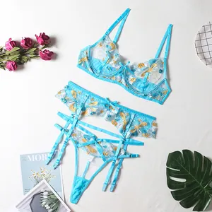 Three-piece sheer mesh lingerie set with floral embroidery and garter belt in blue