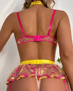 Detailed back view of sexy three-piece lingerie set with pink lace embroidery and yellow satin