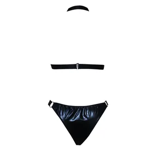 Detail of black faux leather lingerie set featuring metallic O-rings and halter neck straps