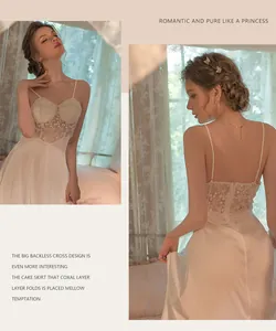 Close-up of pearl white satin nightgown featuring intricate lace detailing and open back