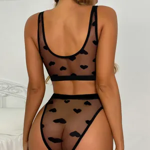 Back view of black mesh lingerie set with flocked heart patterns and high-waist cut