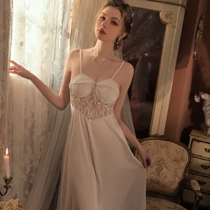 Elegant white silk slip dress with lace patchwork and thin straps in classic vintage style