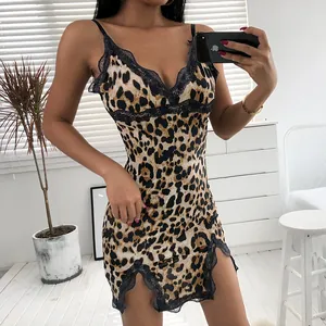 Sexy leopard print slip dress with black lace trim and side slits in a slim fit