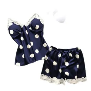 Navy blue polka dot pajama set for women with white lace trim and built-in chest pads