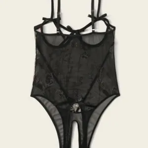 Black mesh lace teddy lingerie with floral embroidery, bow details, and cutout design