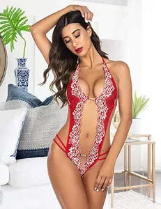 Detail of red lace lingerie featuring a halter neck and white floral lace trimming