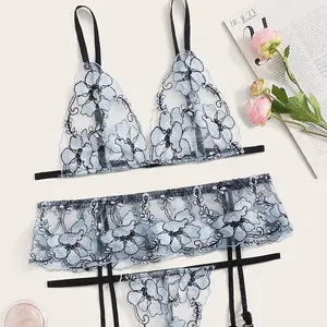 Three-piece light blue mesh lingerie set with floral embroidery and black straps