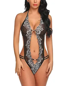 Close-up of black floral lace and white embroidery on a deep V halter bodysuit
