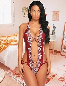 Detail of red floral lace embroidery and sheer fabric on a sexy halter lingerie bodysuit