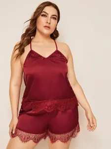 Detail of wine red satin pajama set with delicate eyelash lace trim for women