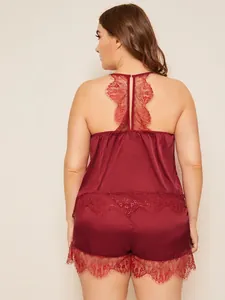 Detail of burgundy satin sleepwear featuring delicate eyelash lace trim on the back