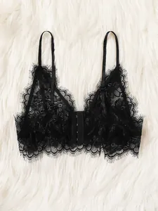 Sexy black eyelash lace bralette with front closure and adjustable straps on white fur