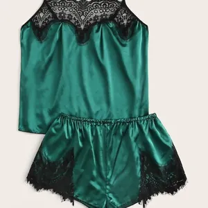 Dark green satin lingerie set with black lace trim featuring camisole top and shorts