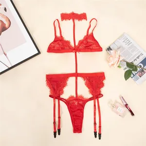 Detailed close-up of red floral lace lingerie set with halter bra and garter belt
