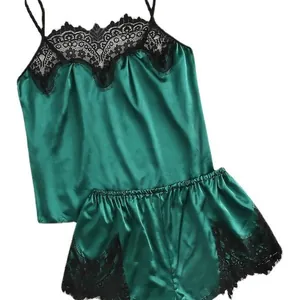Deep green satin lingerie set with delicate black lace trim and spaghetti straps