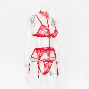 Detail of red floral lace lingerie set featuring garter belt and matching choker accessory