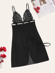 Detailed view of sheer black lace and mesh nightgown with deep V-neck and ribbon tie