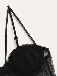 Sexy black lace lingerie with mesh polka dots and delicate straps for a refined look