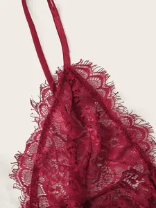Detailed close-up of dark red eyelash lace bralette with delicate semi-transparent floral patterns