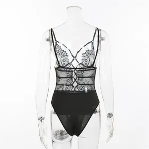 Detailed back view of black lace bodysuit featuring cross-strap design and sheer mesh