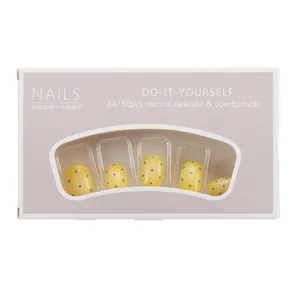 Short press-on nails set with lemon yellow and light blue polka dot pattern design