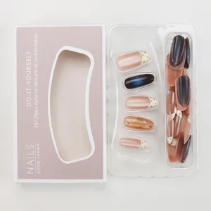 Detail of press-on nails set with pink blue gradient stars and dots in purple packaging