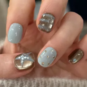 Short punk press-on nails with blue and brown contrast colors, stars and stripes