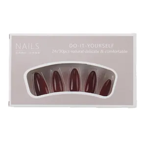 Glossy almond wine red press-on nails set displayed on professional packaging