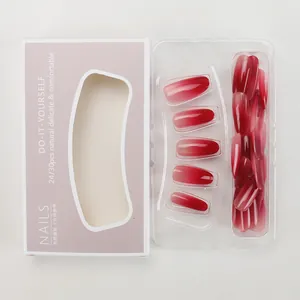 Detailed view of gradient burgundy press-on nails in purple packaging box