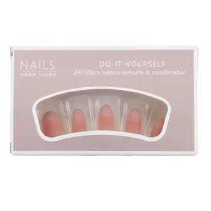Press-on nails in nude pink gradient with matte finish in a compact purple box