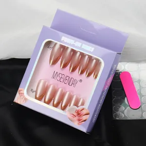 Champagne gold French gradient almond press-on nails set with tools in a purple box