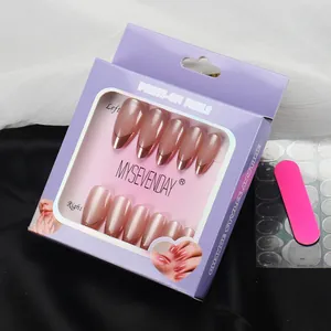 Macro view of pearlescent pink press-on nails with metallic French tips and tools