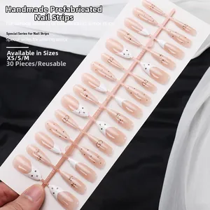 Detail view of 30pcs handmade almond press-on nails with cute cat and heart patterns