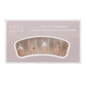 Almond nude gradient press-on nails with white French tips and bear paw patterns
