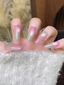 Macro view of pink and blue gradient cat-eye press-on nails in trapezoid shape
