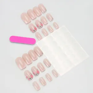 Unghie finte rosa stile French con glitter, fiori 3D e strass con kit applicazione