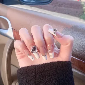 French tip coffin press-on nails with naked pink base and large heart-shaped diamond crystals